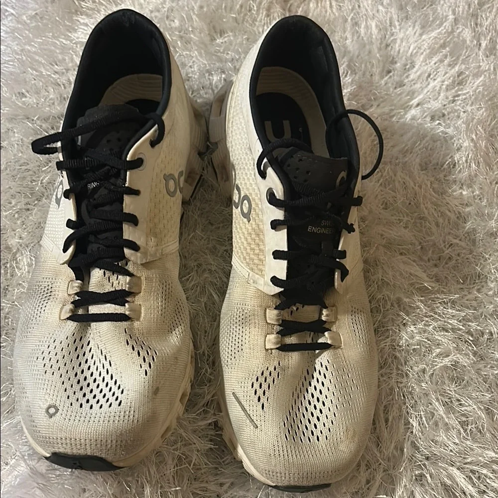 On Running Black and Cream Athletic Shoes